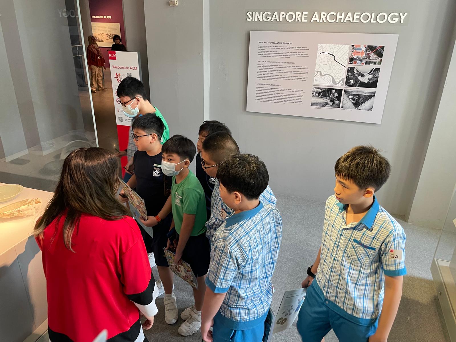 A group of students looking at the exhibits at ACM.