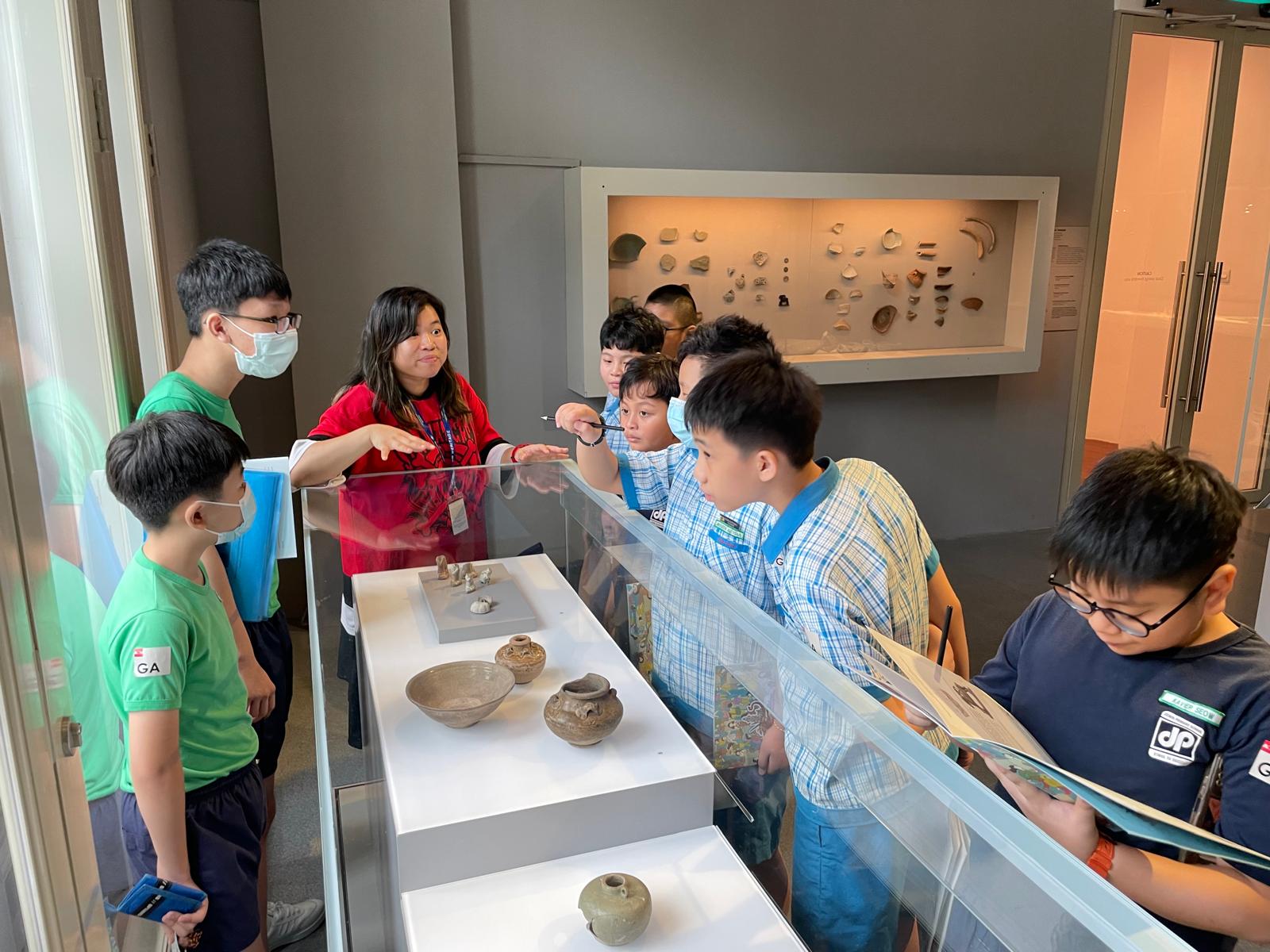 A group of students looking at the exhibits at ACM.