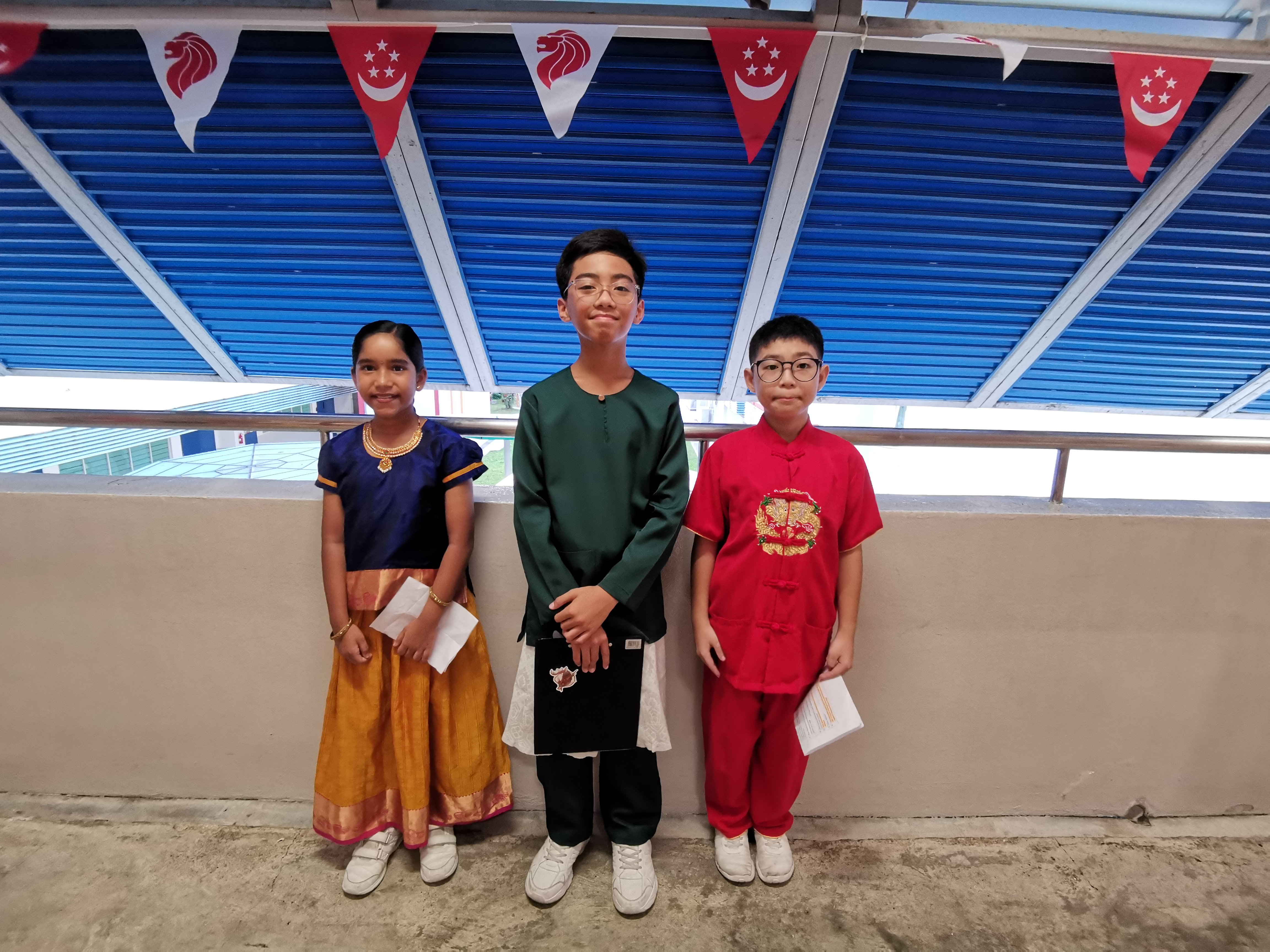 Our Emcees in traditional costumes during RHD